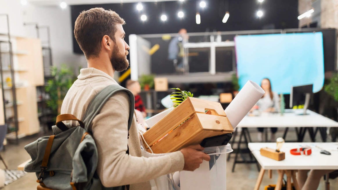 offboarding-employee-leaving-with-box-of-belongings